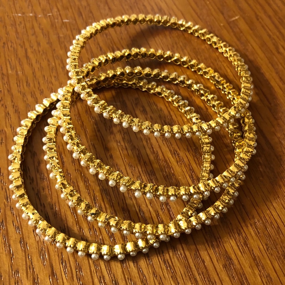 Gold tone and faux pearl bracelets
